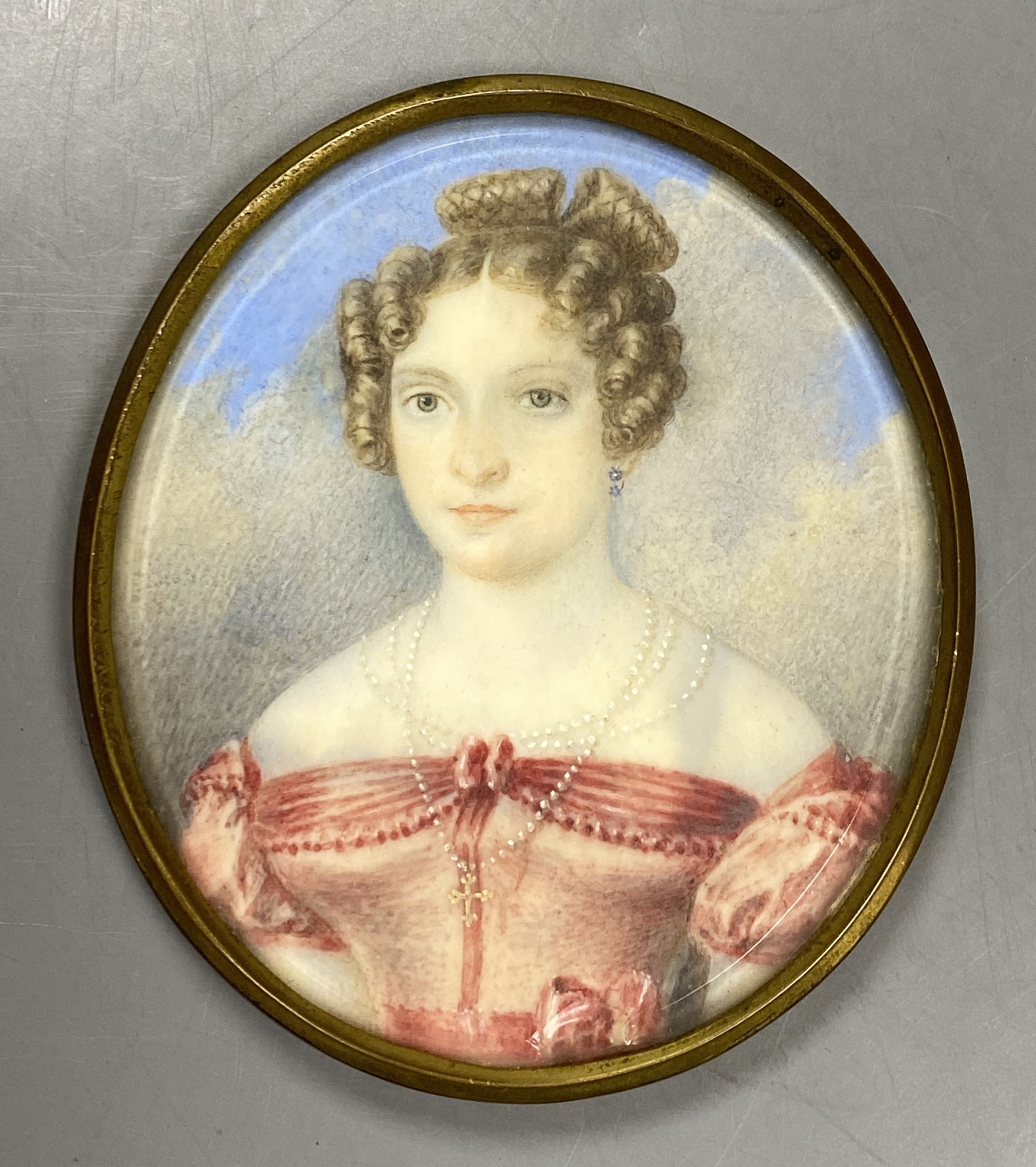 Continental School (19th century), miniature watercolour portrait of a young lady, 7.3cm